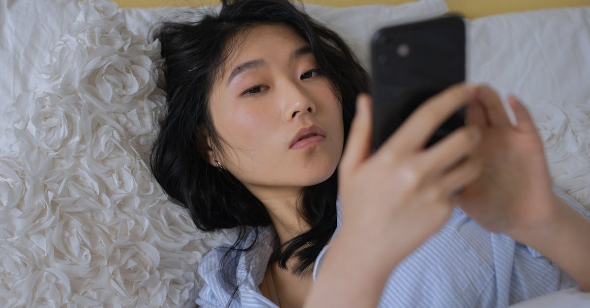 asian woman using smartphone to watch tiktok